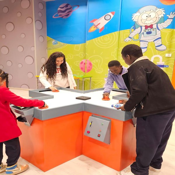 Young learner participating in an interactive UNHCR educational workshop encouraging creativity and skill building