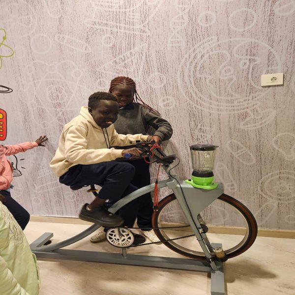 Child taking part in a UNHCR interactive learning activity that encourages exploration and educational growth